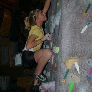 young girl rock climbing